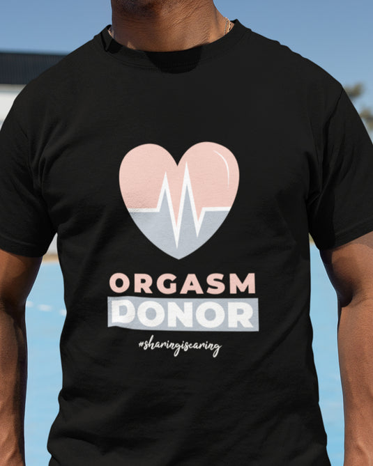 Black graphic T-shirt with a heart and ECG line design featuring "Orgasm Donor" text, perfect for bold statement and adult humor lovers.