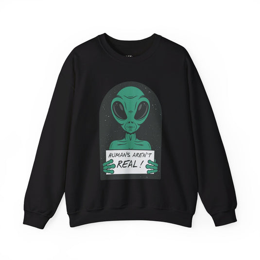 Black sweatshirt with a humorous alien graphic holding a sign that reads "Humans Aren't Real!" in a sarcastic style.