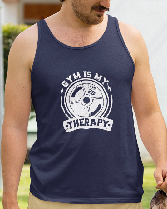 Model wearing a navy graphic tank top with the phrase "Gym is My Therapy" and a weight plate design, ideal for gym enthusiasts, for men and women.