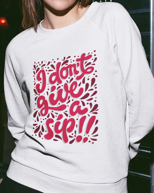 White funny graphic sweatshirt with "I Don't Give a Sip" text, perfect for sarcasm and wine lovers seeking bold humor.