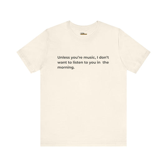 Natural-colored tee with a humorous black text, expressing a preference for music over morning conversations.