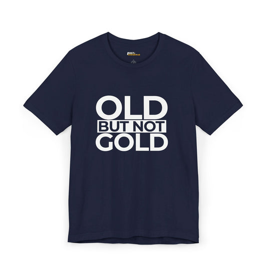 Navy unisex tee with strong white text 'Old But Not Gold,' a fun gift for those who aren’t golden but still grinning.