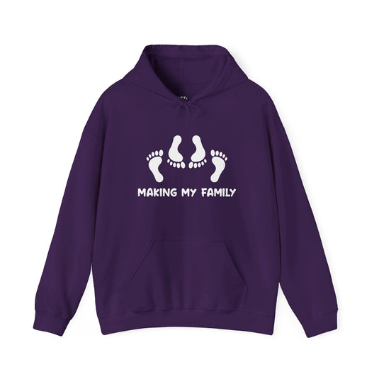 Purple hoodie featuring the "Making My Family" design with footprints, offering a playful adult humor twist for men who enjoy wit.