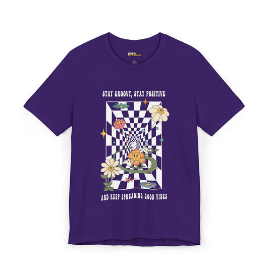 Purple t-shirt with trippy flowers and a checkerboard design, spreading groovy vibes for men and women who love festivals.