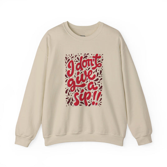 Sand-colored sweatshirt featuring the fun "I Don't Give a Sip" design, perfect for women who love wine and sarcasm.