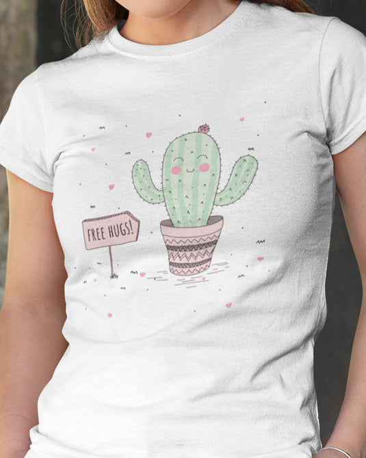 White women's graphic tee featuring a cute cactus illustration with a "Free Hugs" sign in a sarcastic style.