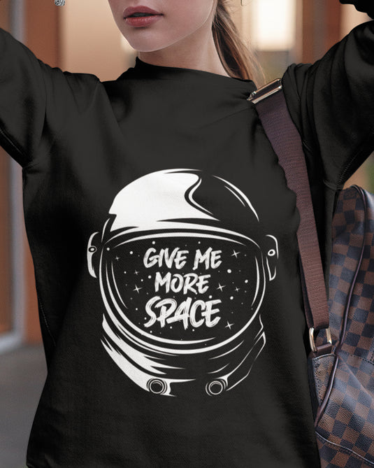 Black sarcastic graphic sweatshirt with "Give Me More Space" astronaut helmet design, perfect for humor lovers and bold fashion fans.