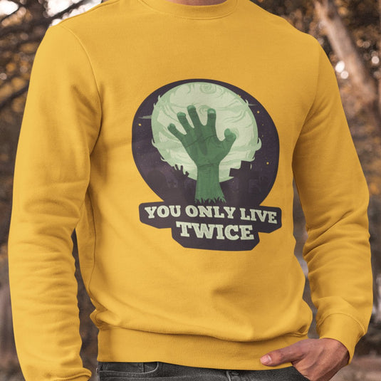 Yellow sarcastic graphic sweatshirt with "You Only Live Twice" zombie hand design, perfect for humor lovers and bold statement fans.