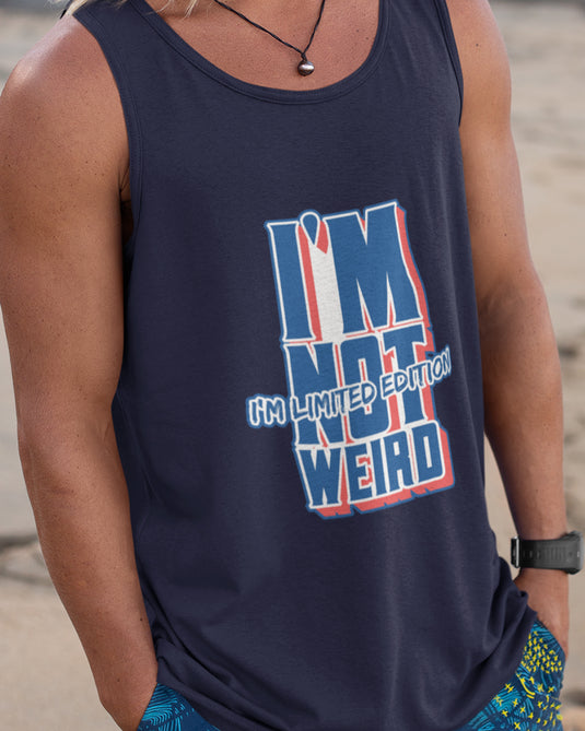 Man wearing a navy graphic tank top with the sarcastic phrase "I'm not weird, I'm limited edition," perfect for showcasing unique personality.