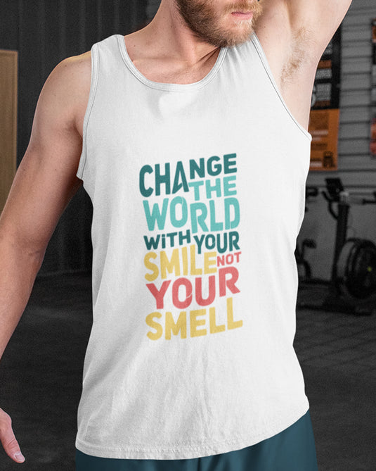 Man wearing a white graphic tank top with the sarcastic phrase "Change the world with your smile, not your smell," ideal for men and women