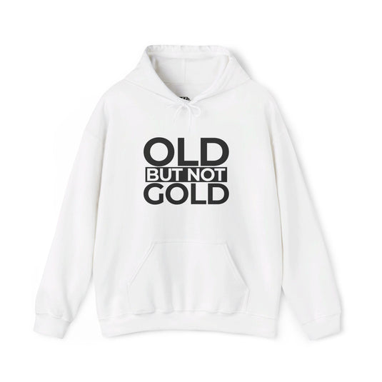 White hoodie for men and women featuring bold 'Old But Not Gold' design, ideal for those who embrace their age with humor.