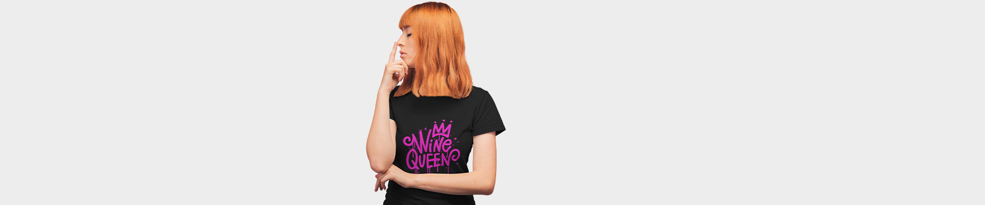 Woman wearing a black graphic t-shirt, stylish and humorous, perfect for trendy and funny women's tees.